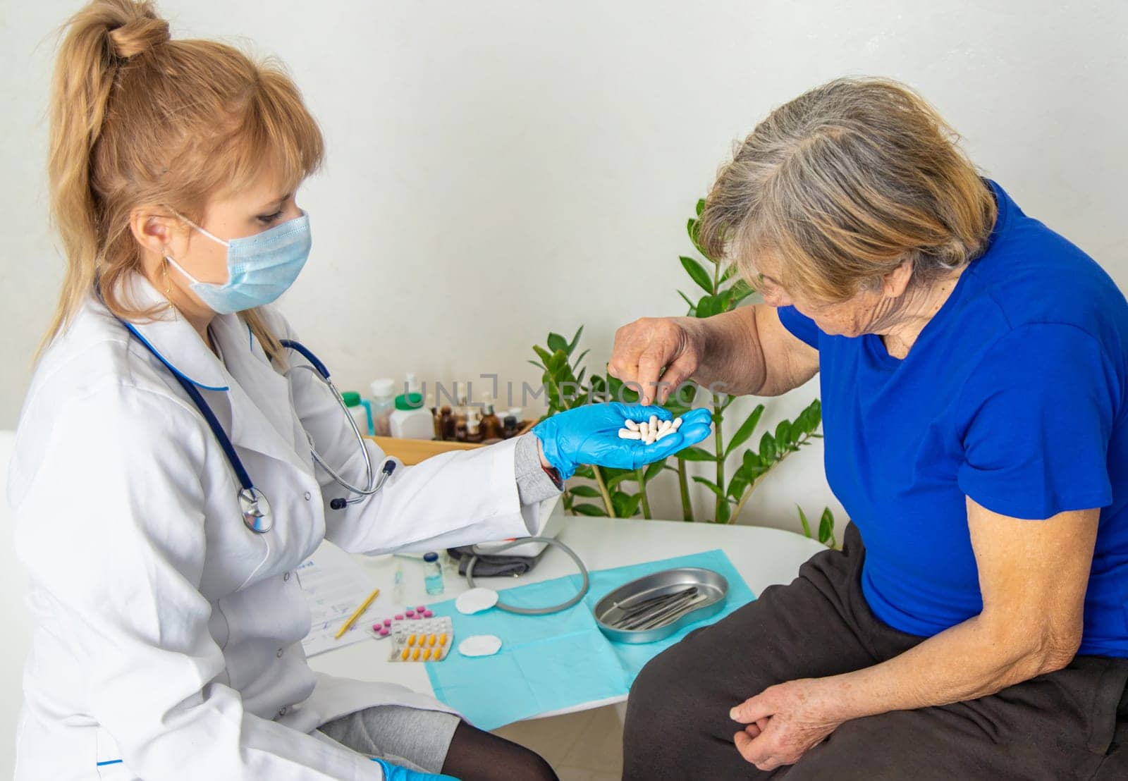 Elderly woman at a doctor appointment. Selective focus. People.