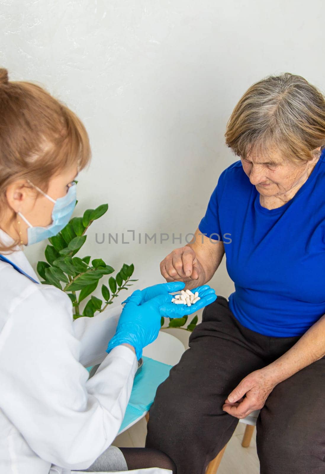 Elderly woman at a doctor appointment. Selective focus. People.