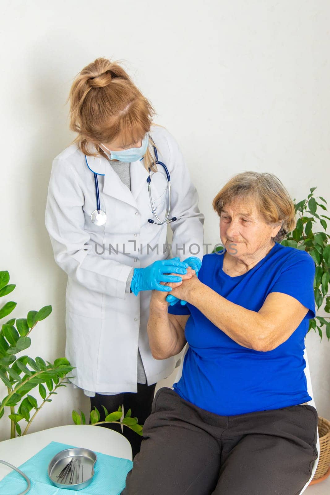 Elderly woman at a doctor appointment. Selective focus. People.