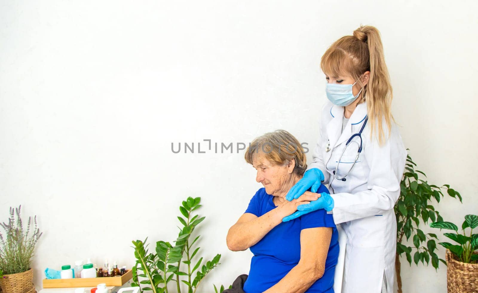 Elderly woman at a doctor appointment. Selective focus. People.