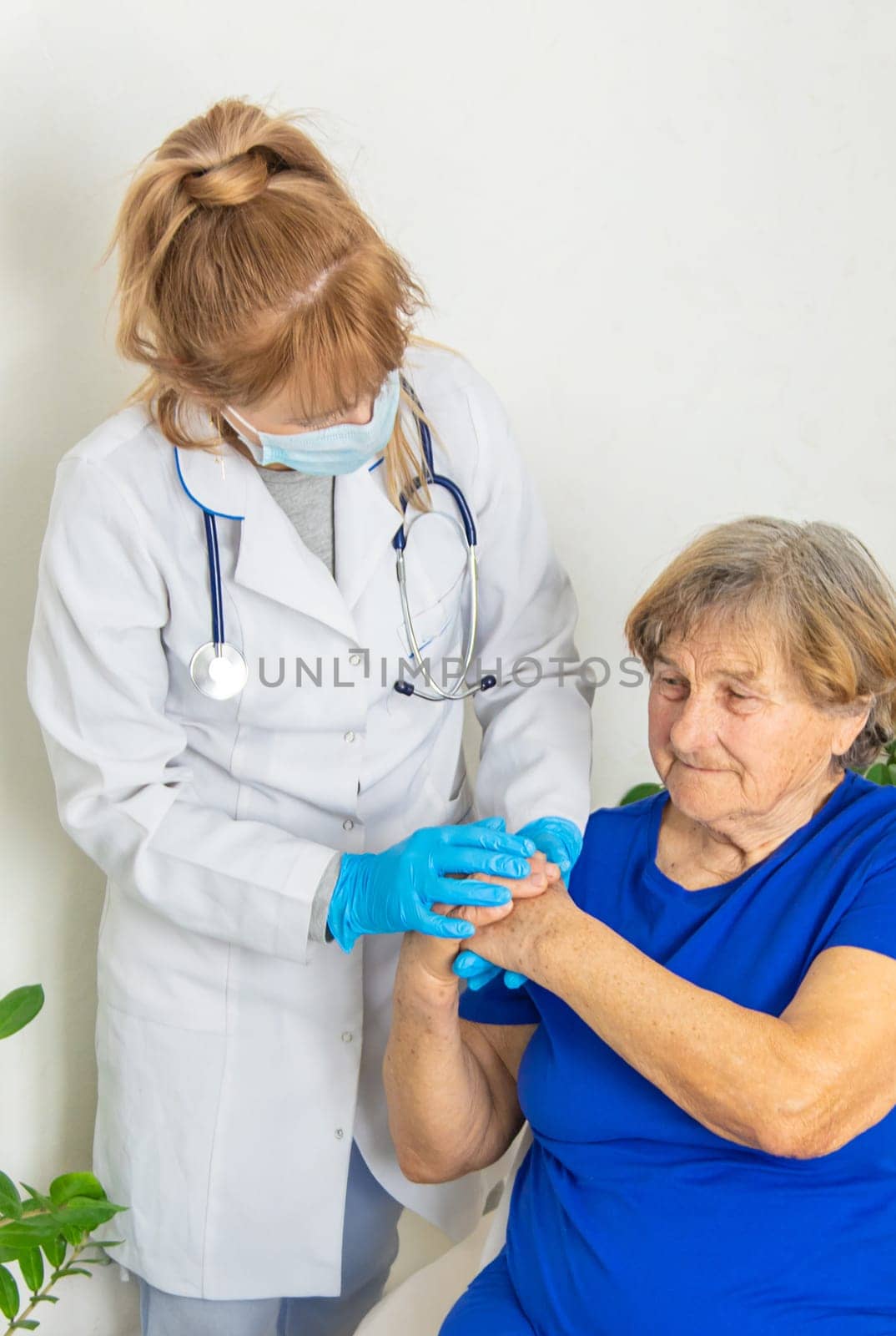 Elderly woman at a doctor appointment. Selective focus. People.