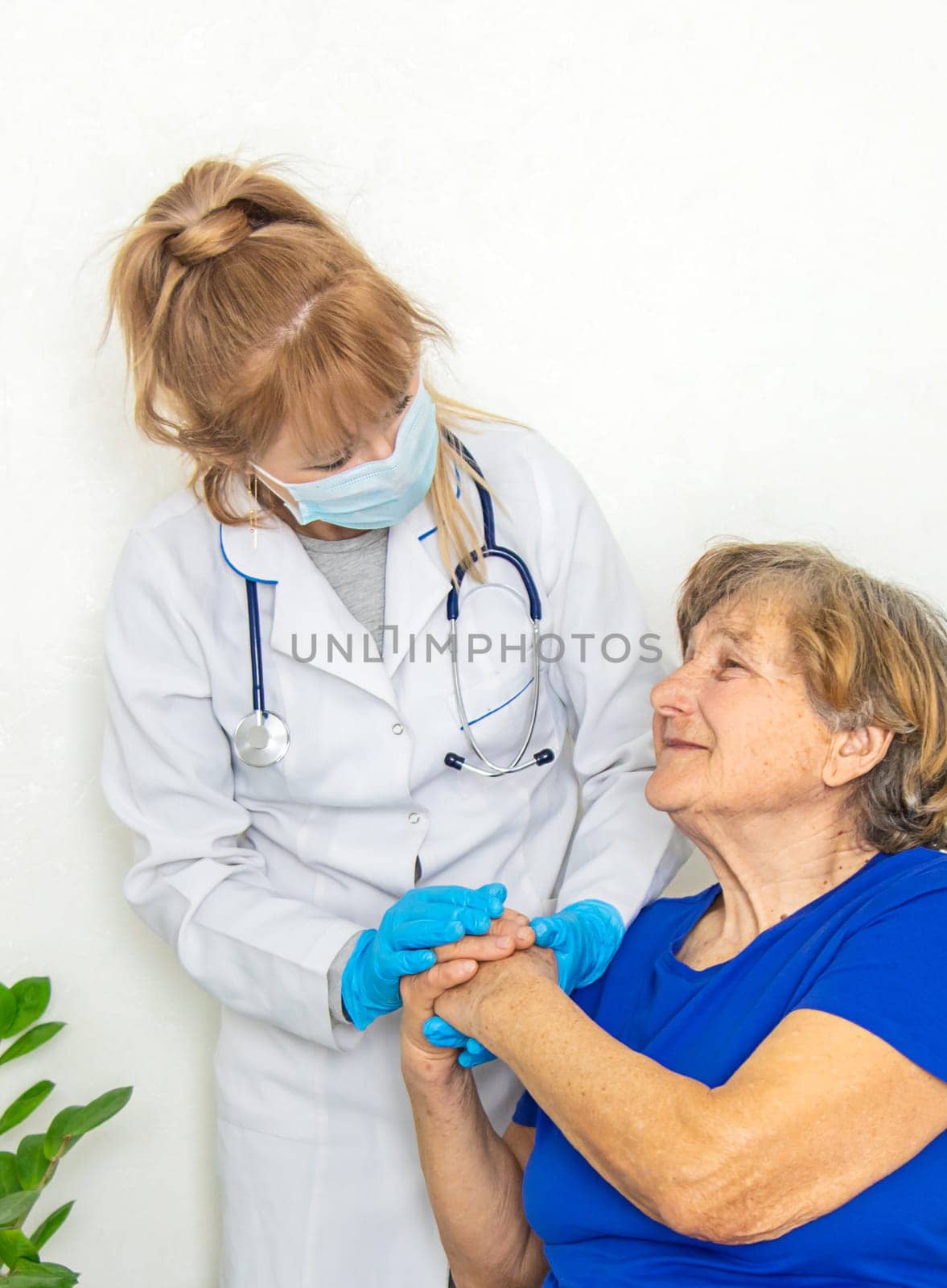 Elderly woman at a doctor appointment. Selective focus. People.