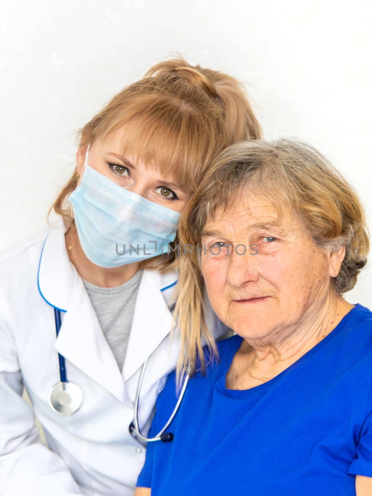 Elderly woman at a doctor appointment. Selective focus. People.