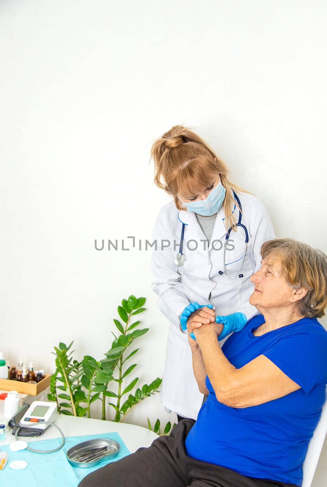 Elderly woman at a doctor appointment. Selective focus. People.