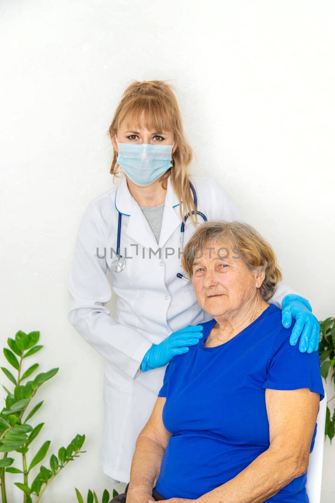 Elderly woman at a doctor appointment. Selective focus. People.