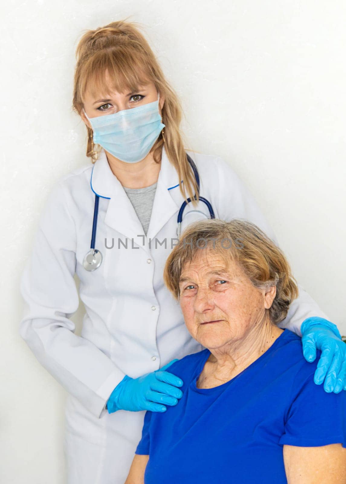 Elderly woman at a doctor appointment. Selective focus. People.