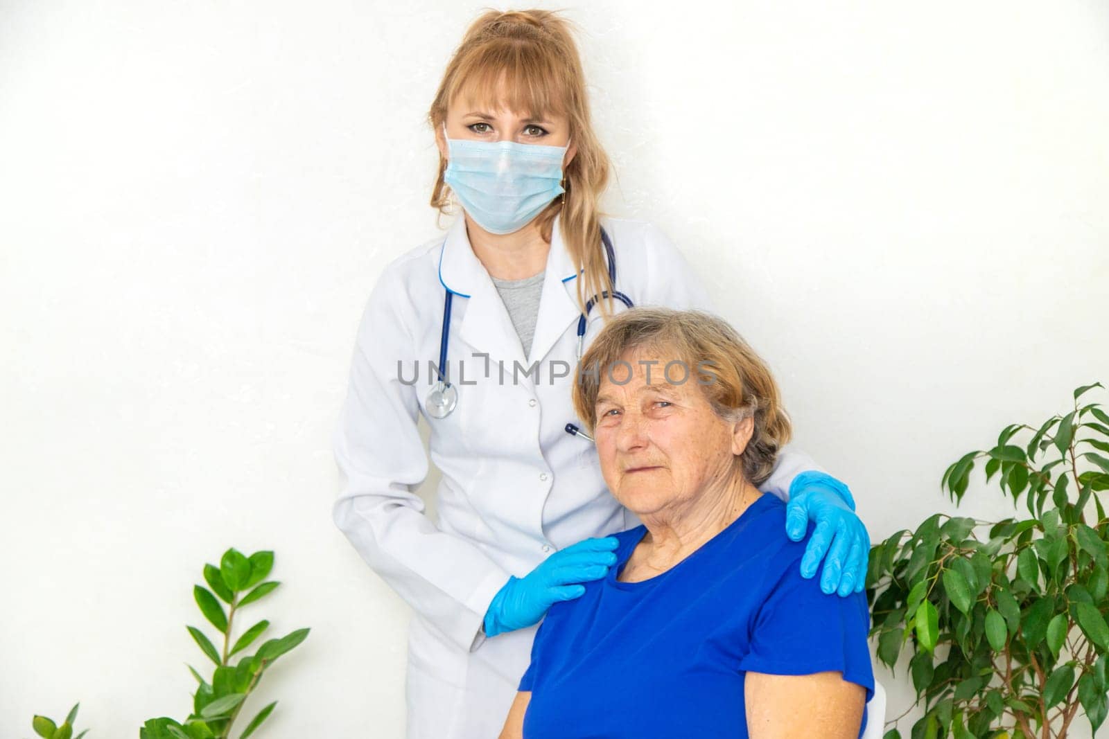 Elderly woman at a doctor appointment. Selective focus. People.