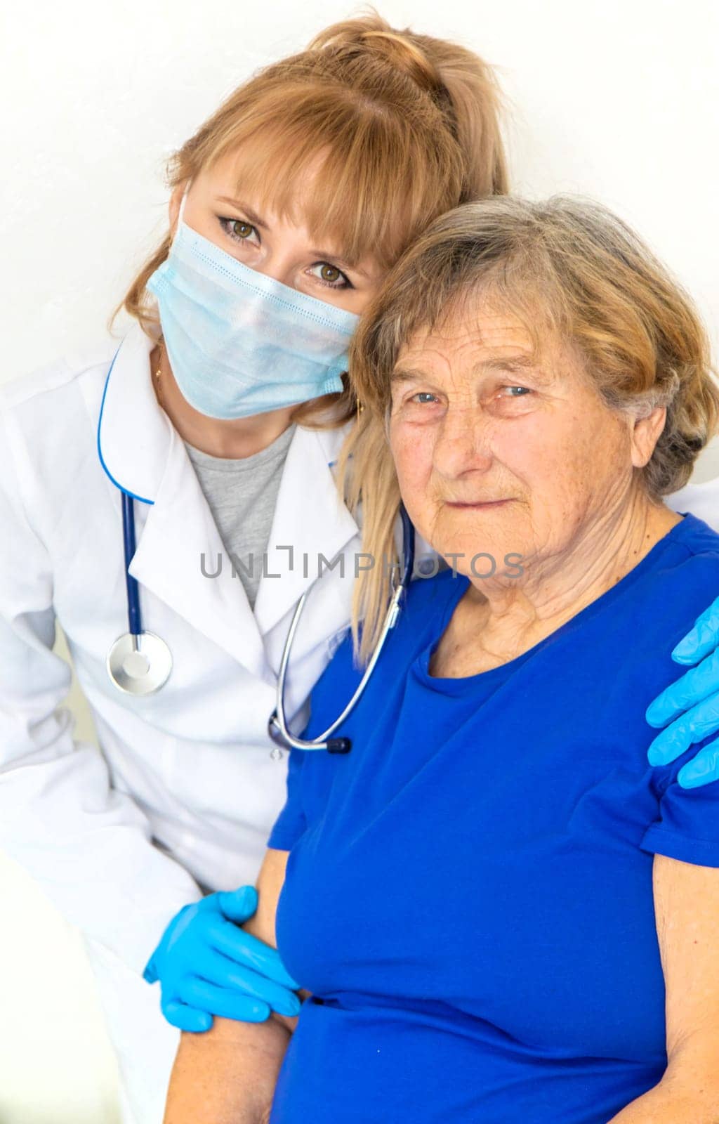 Elderly woman at a doctor appointment. Selective focus. People.