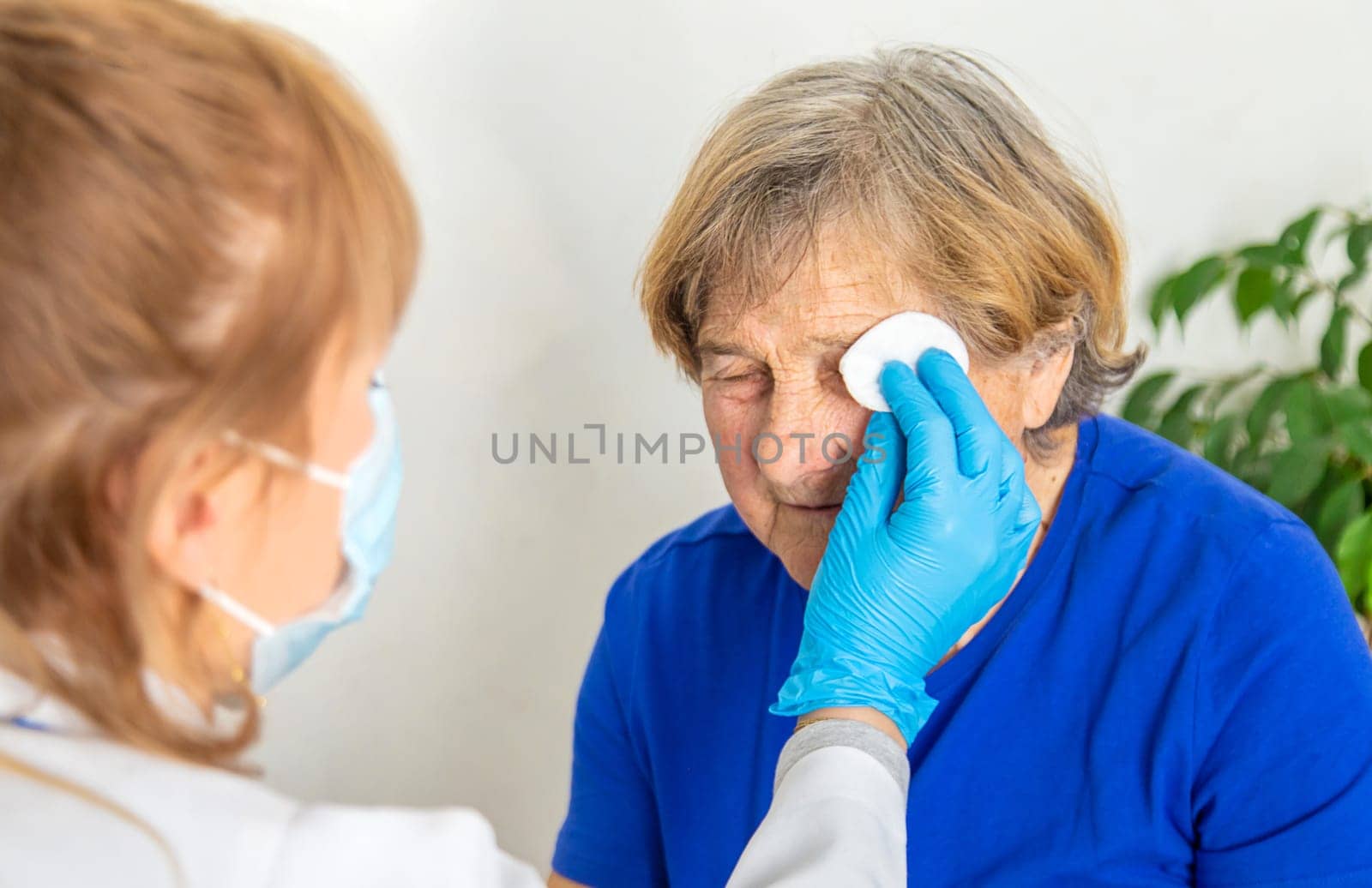Elderly woman at a doctor appointment. Selective focus. People.
