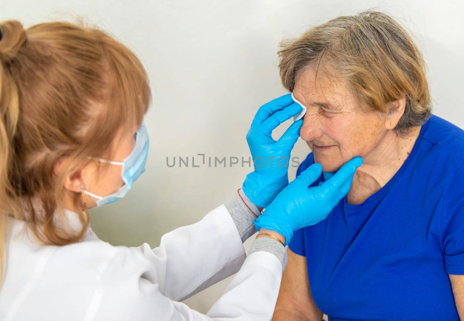 Elderly woman at a doctor appointment. Selective focus. People.