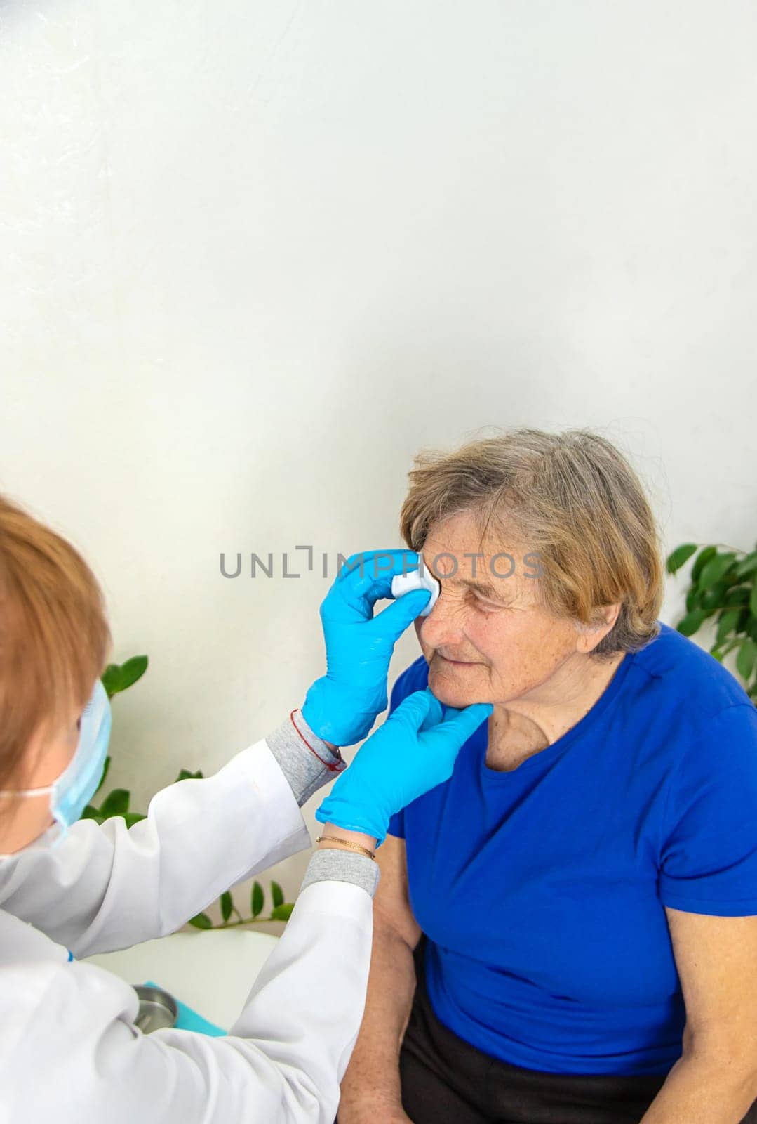 Elderly woman at a doctor appointment. Selective focus. People.