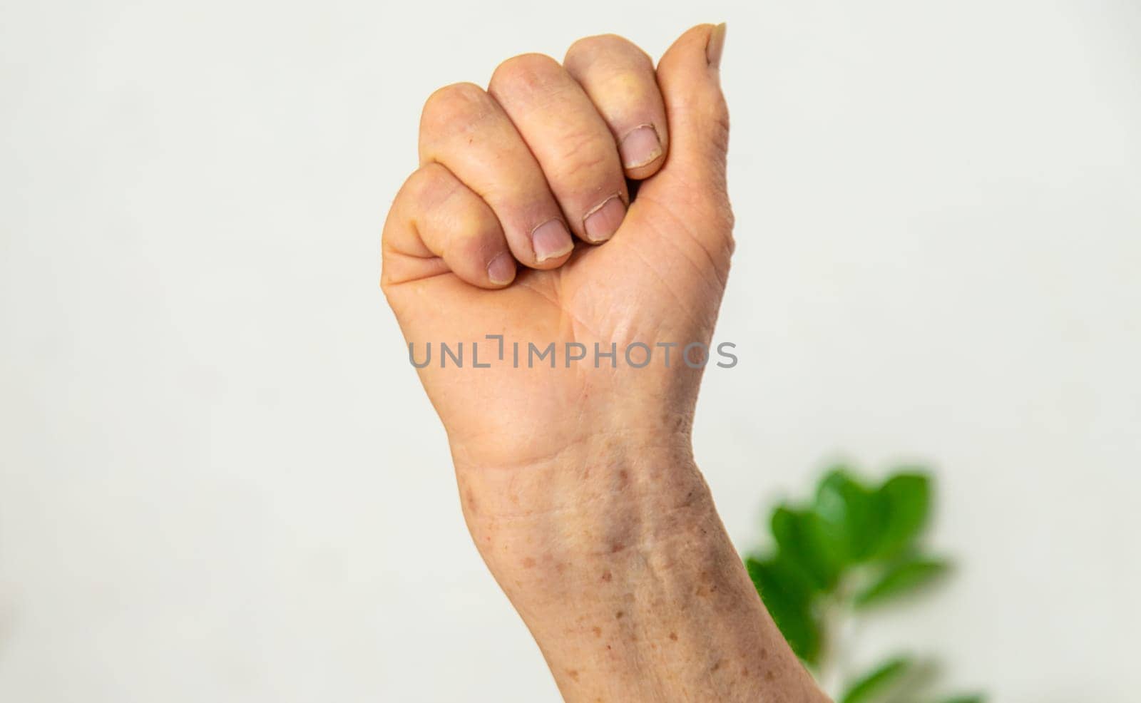 Old woman walking on the hand. Selective focus. people.
