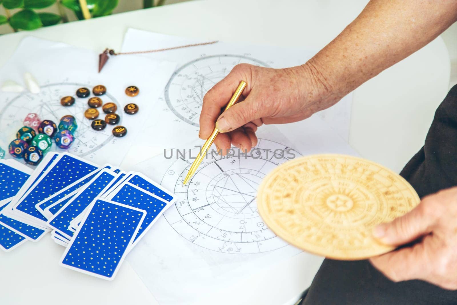 Astrology and fortune telling old fortune teller. Selective focus. people.