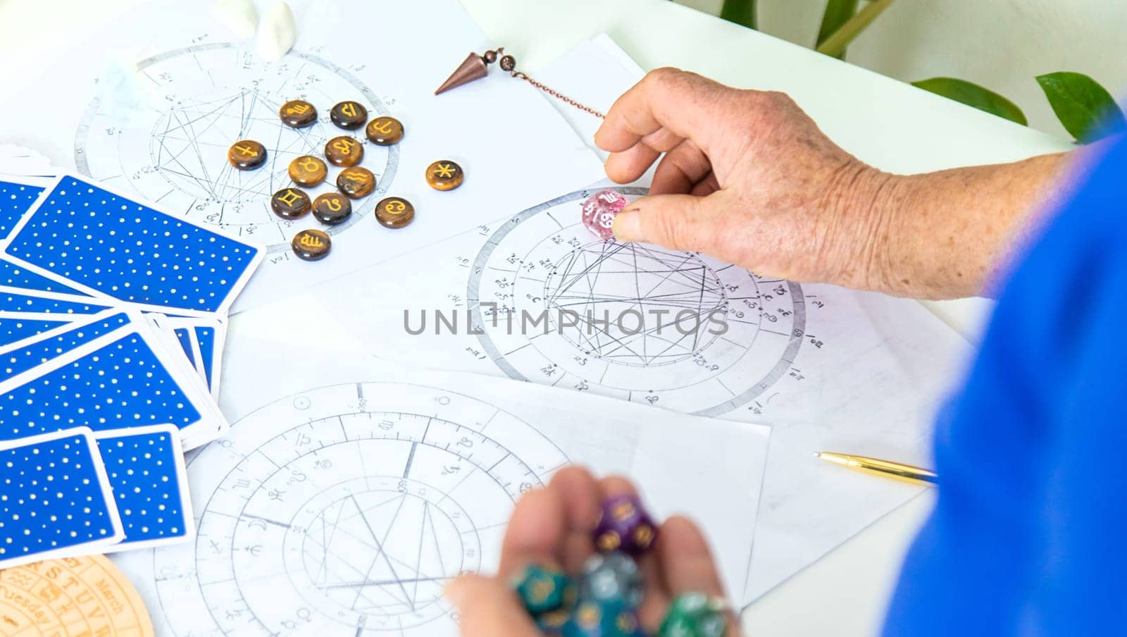 Astrology and fortune telling old fortune teller. Selective focus. people.