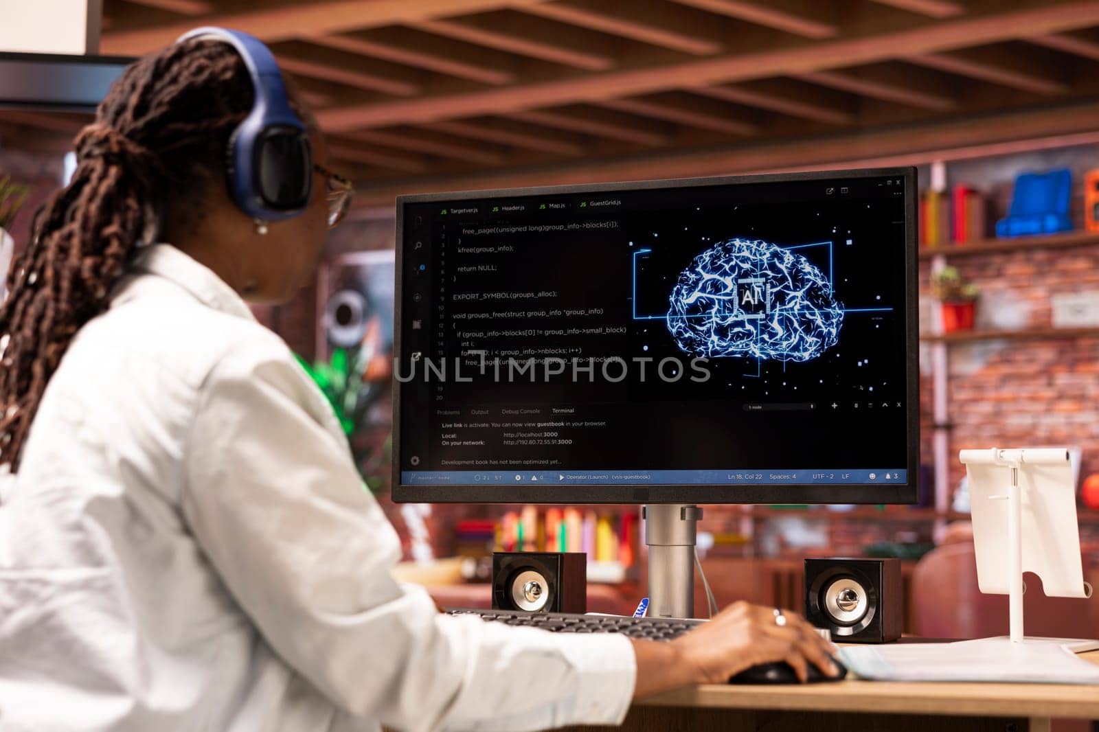 Admin writing code on computer and doing maintenance on artificial intelligence neural networks, listening music. Tech support expert wearing headphones typing on keyboard, doing checkup on AI systems