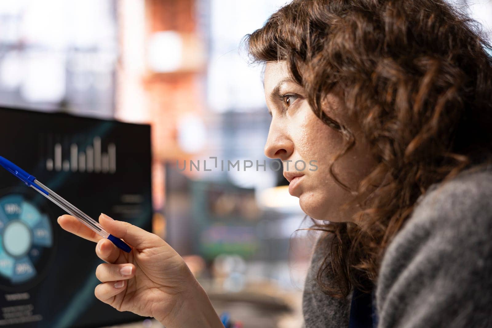 Student doing online learning for career business development, taking notes while watching presentation. Woman gathering information from internet seminar on computer display.