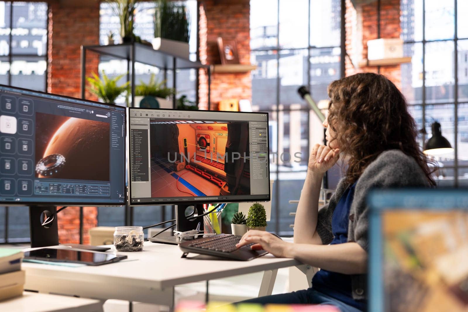Woman works with AI generated app to develop a futuristic spaceship station. Neural network powered software uses automation and machine learning to generate realistic game environments.