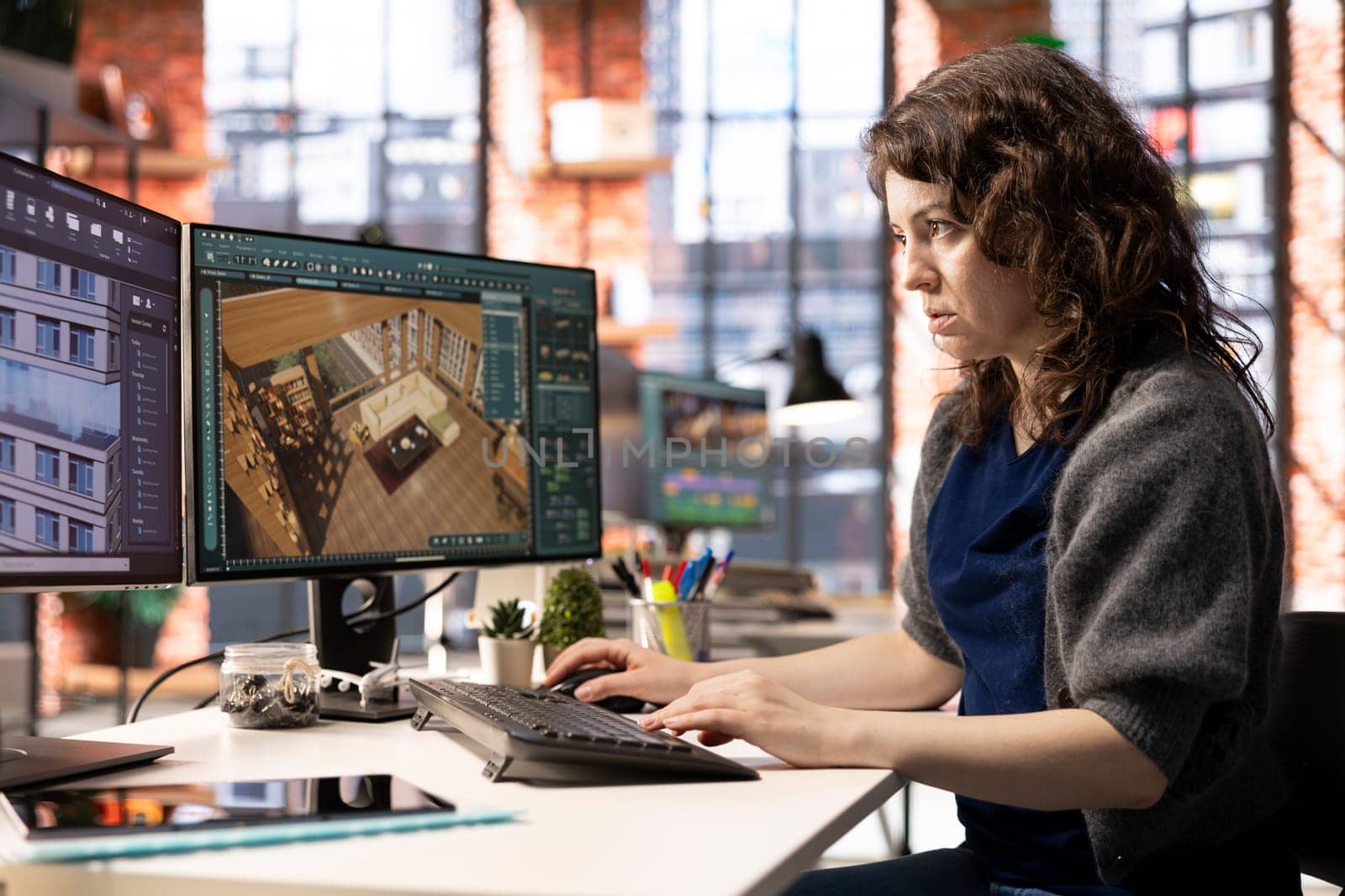 Architectural designer works on a digital home design project, using a 3D modeling program to arrange furniture. The software with advanced user interface for professional rendering.