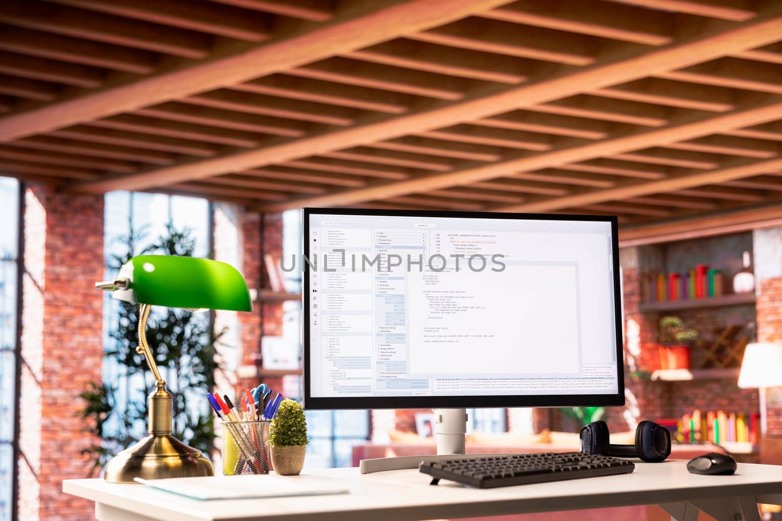 Software development and coding being done on PC screen, implementing algorithms. Code editor on computer display in home office used for building applications and optimizing performance