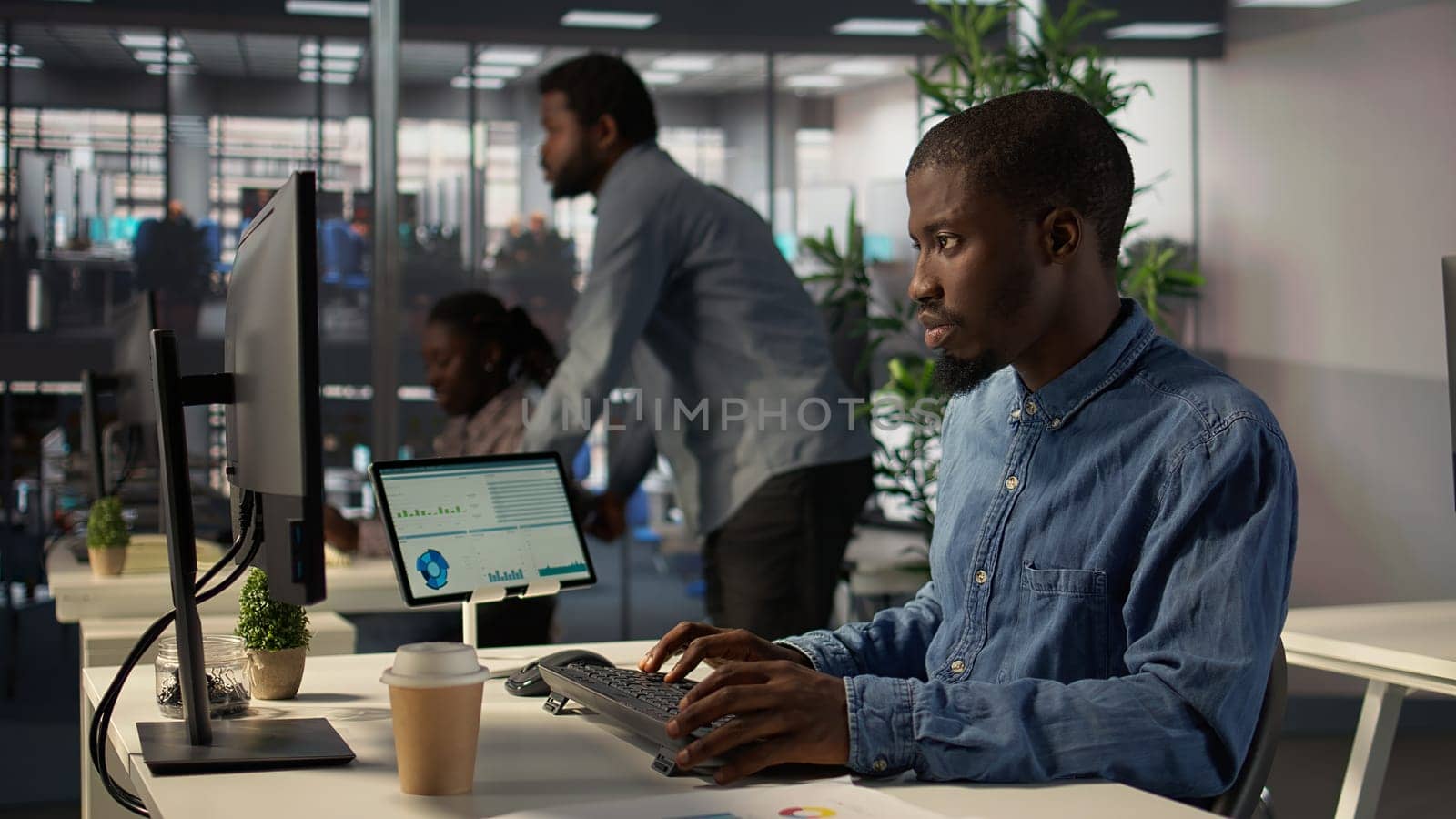 General director in modern office engaged in infographics reports for problem solving tasks, financial planning to support enterprise growth and accomplish strategic objectives. Camera B.