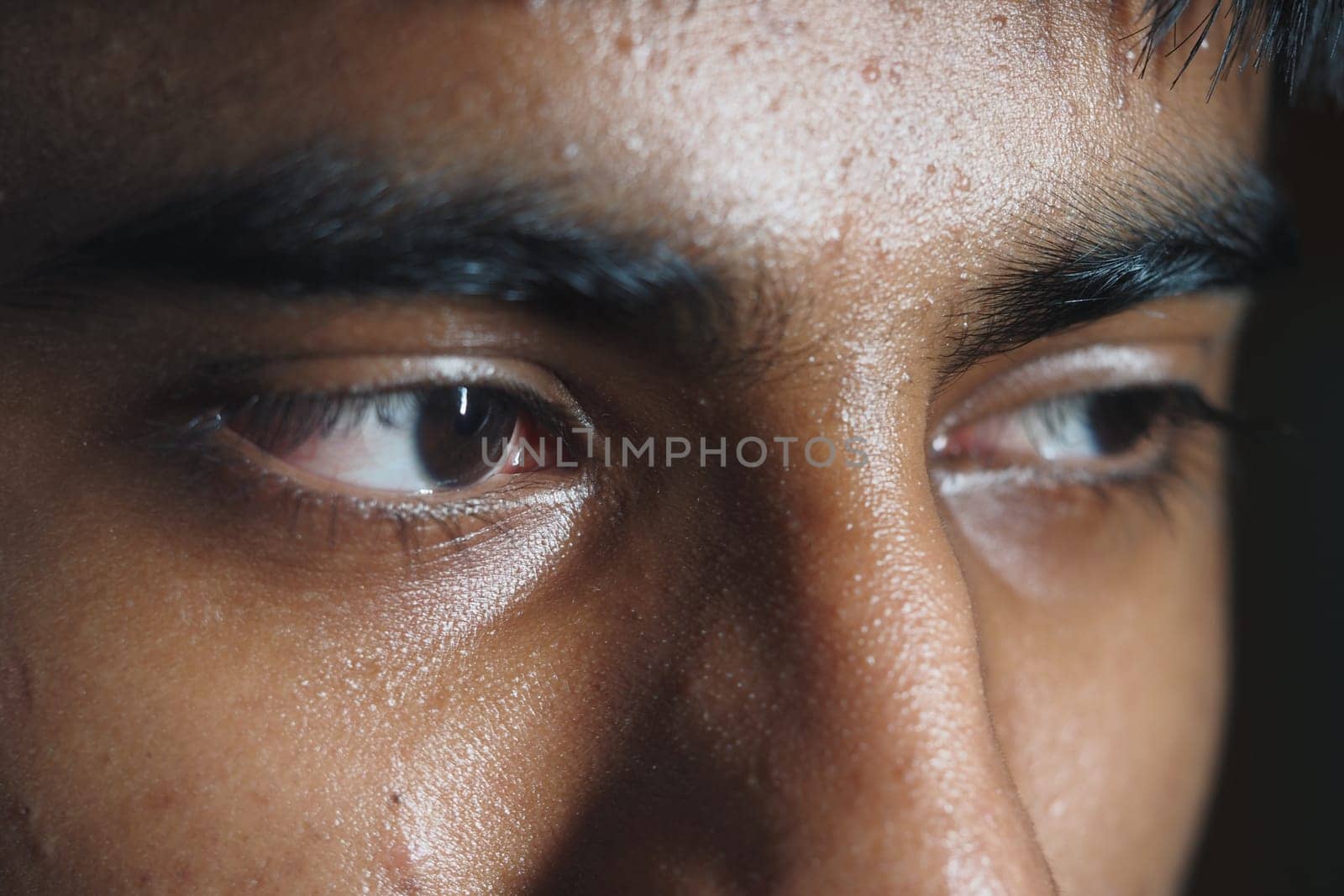 The expressive gaze reveals inner feelings and contemplation.