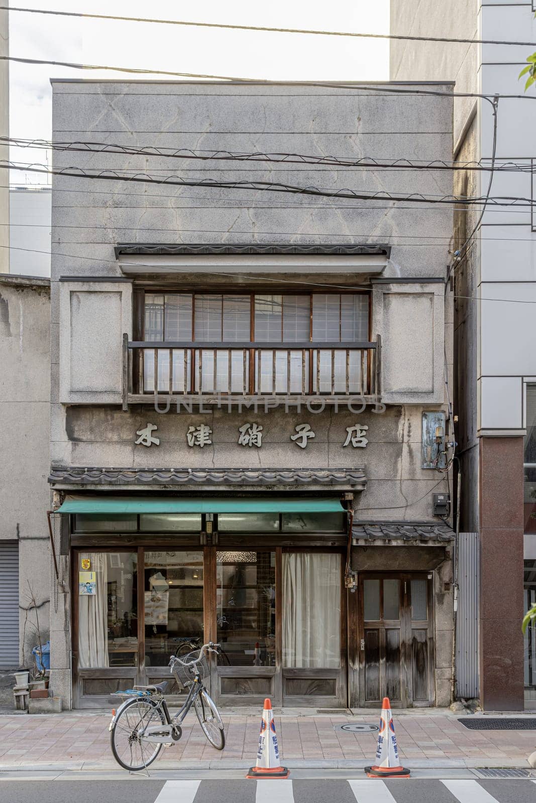 Traditional japanese shopfront preserving architectural heritage in urban setting