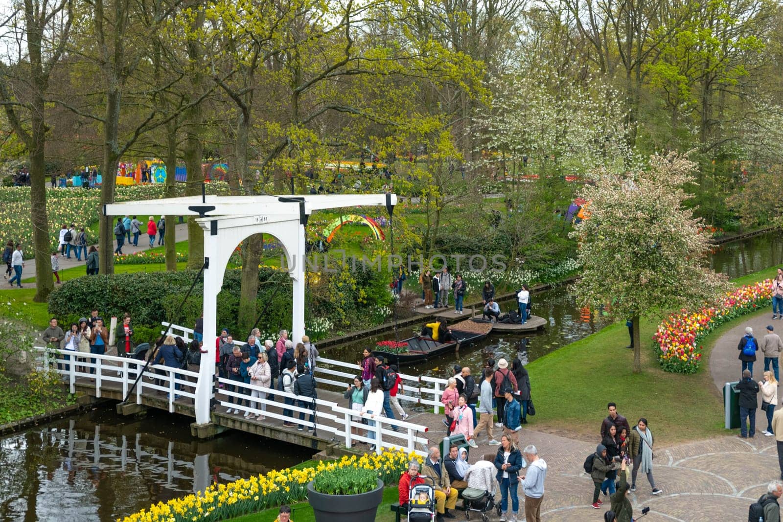 Lisse, Netherlands - April 17, 2019: Numerous people walk in a Keukenhof park View from above