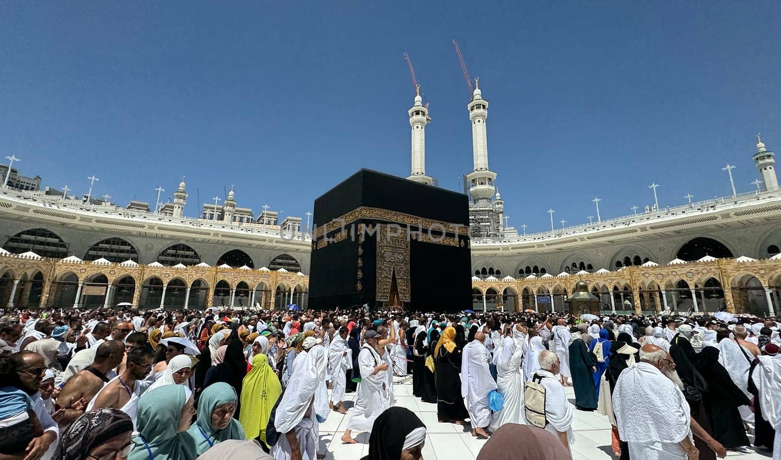 MECCA, SAUDI ARABIA - MAY 02 2024: View on Kaaba from second floor of Masjid Al Haram through some new constructions building around the masjid. High quality photo