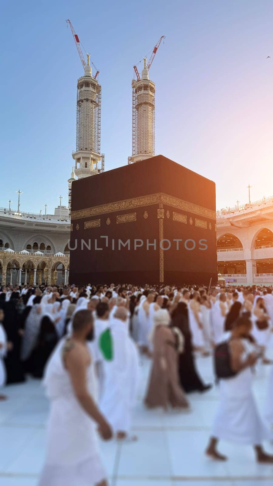MECCA, SAUDI ARABIA - MAY 02 2024: View on Kaaba from second floor of Masjid Al Haram through some new constructions building around the masjid. High quality photo