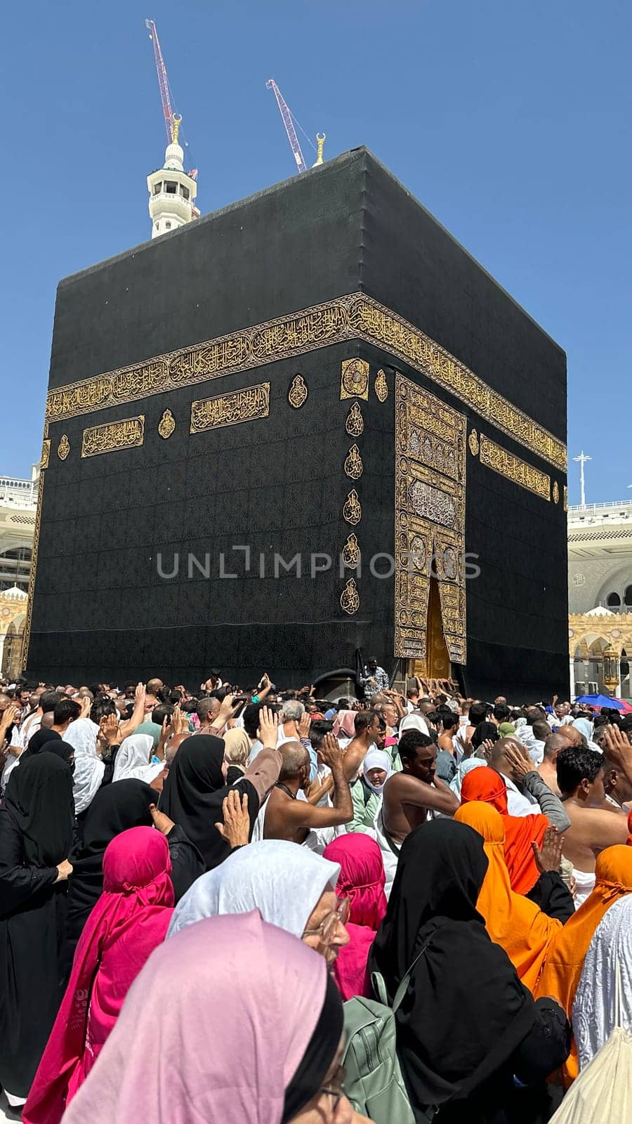 MECCA, SAUDI ARABIA - MAY 02 2024: View on Kaaba from second floor of Masjid Al Haram through some new constructions building around the masjid. High quality photo
