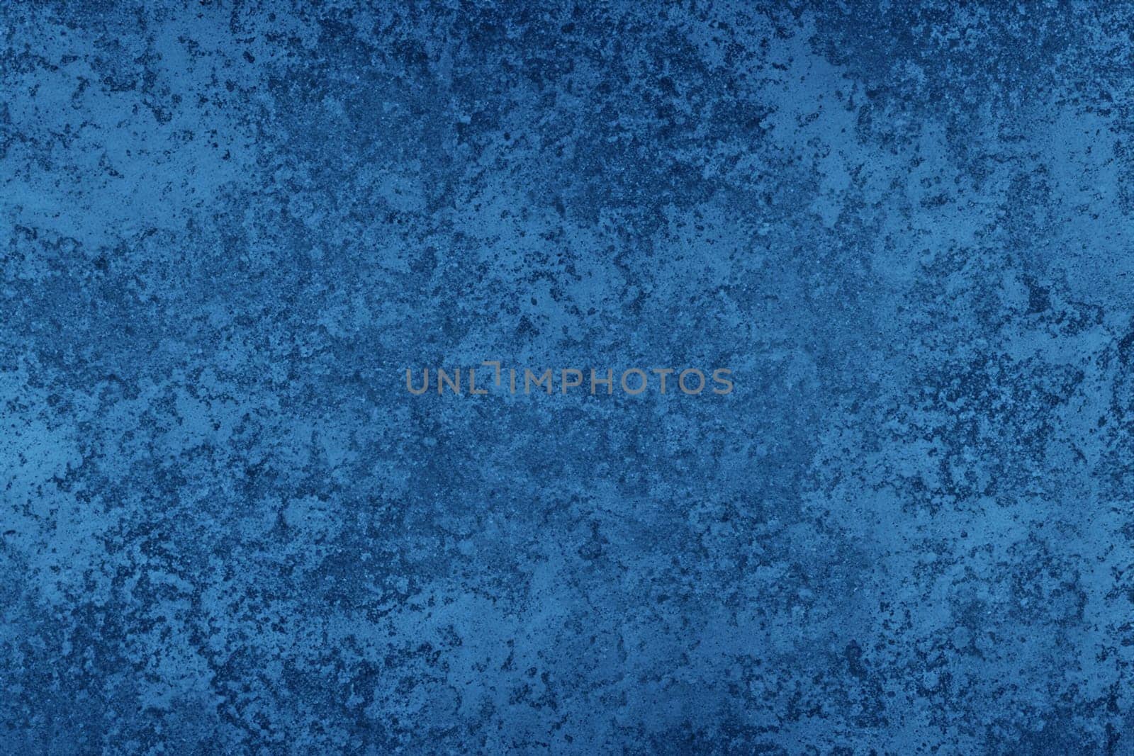 Abstract decorative dark blue plaster wall background