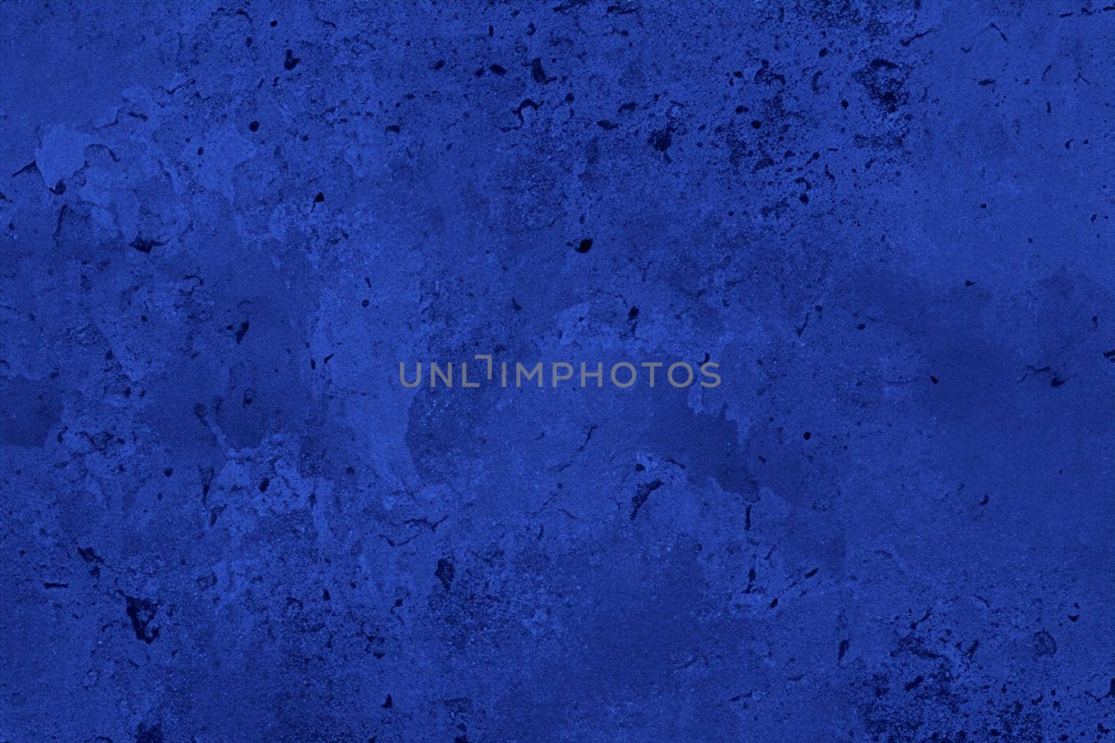 Abstract decorative dark blue plaster wall background