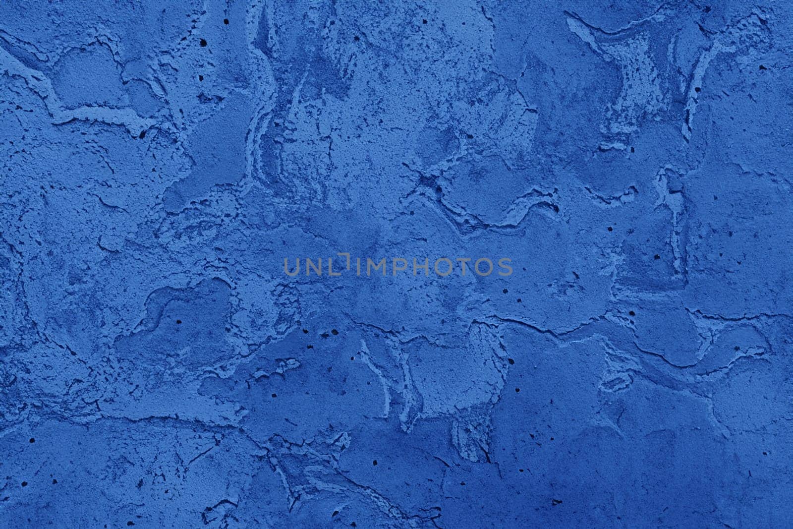 Abstract decorative dark blue plaster wall background