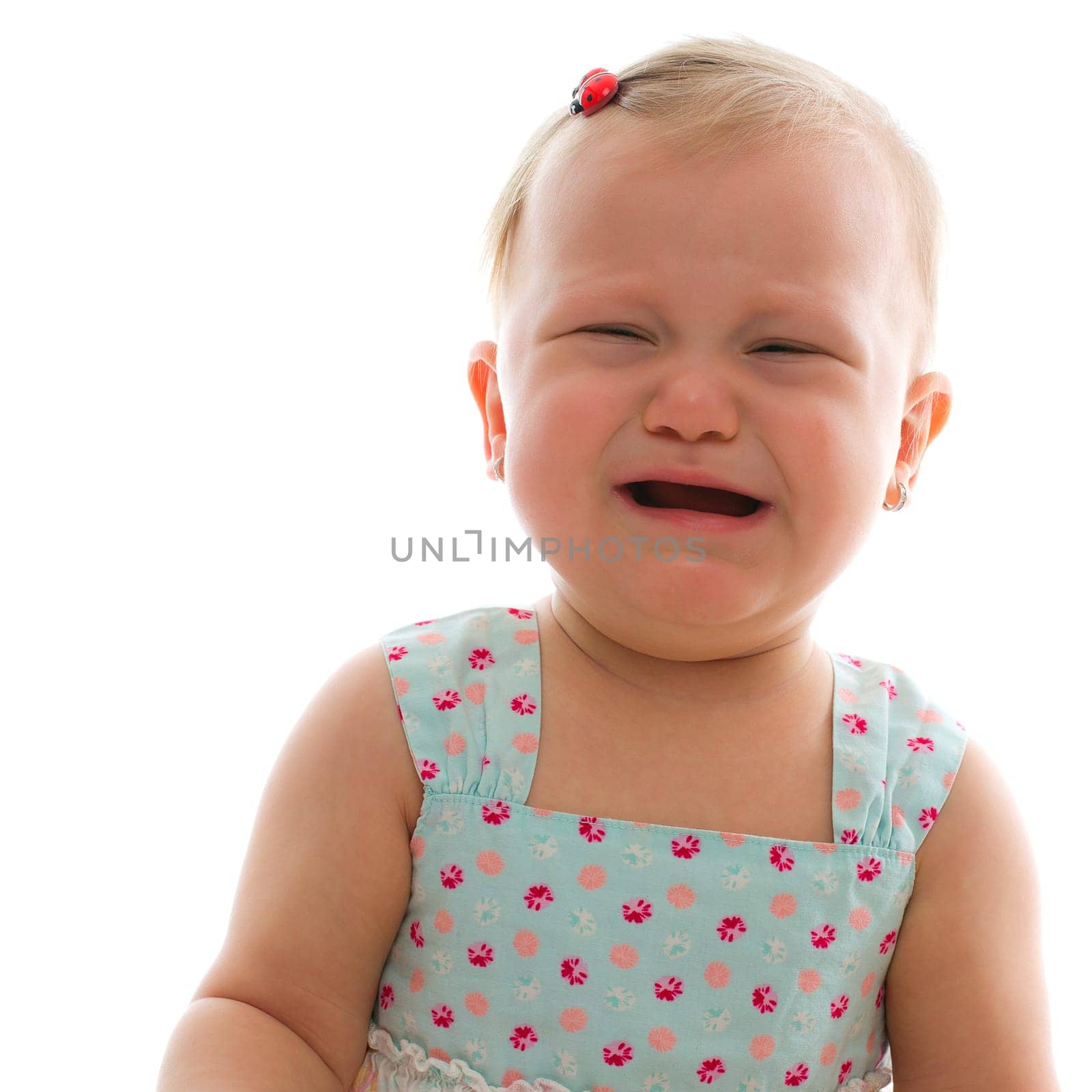 crying baby girl - studio shot over white