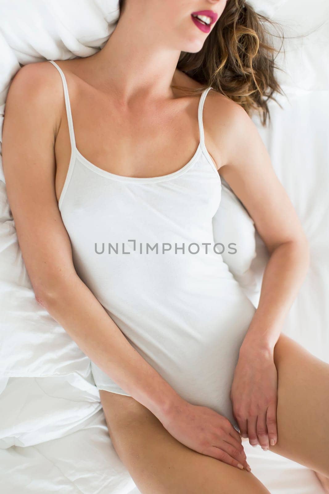 Attractive woman in the bed