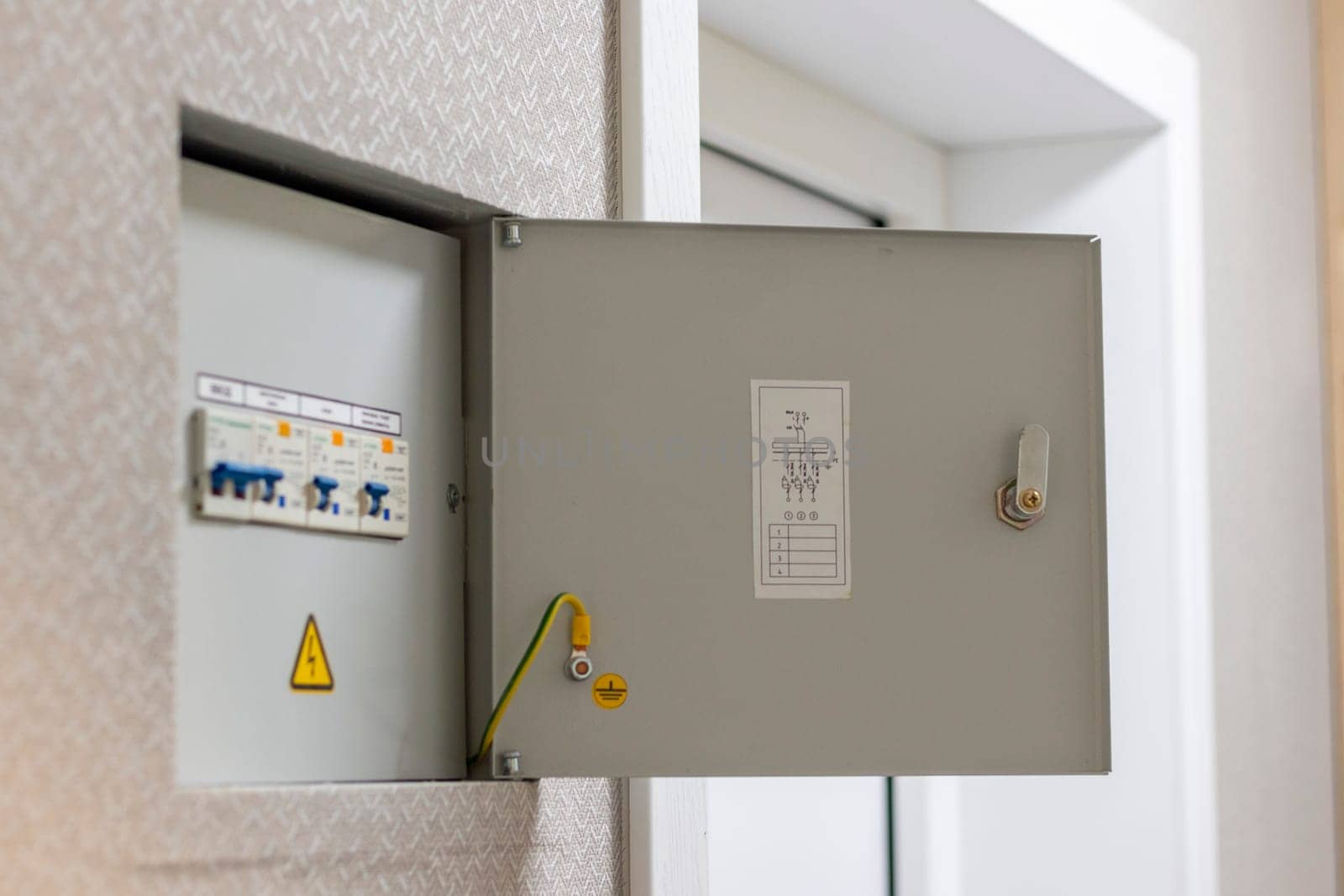 Open electrical switchboard in the apartment