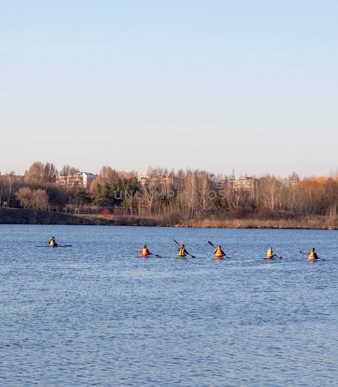 Group of people kayaking on the open water