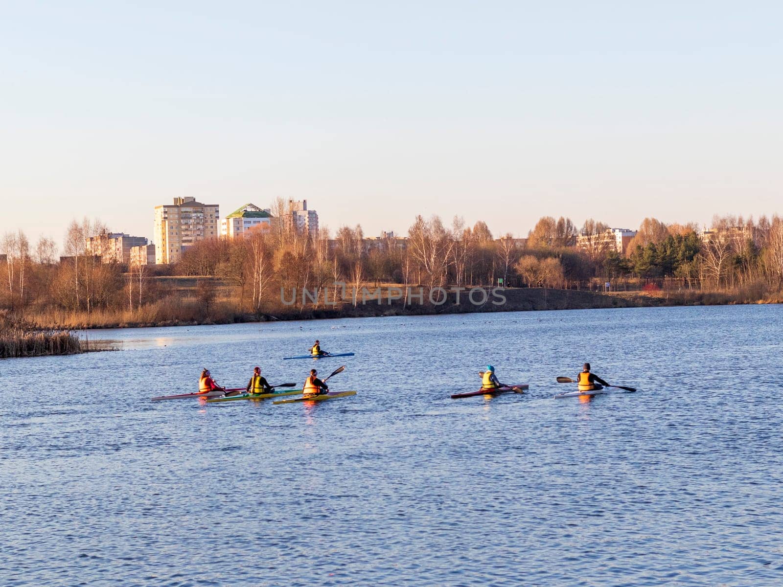 Group of people kayaking on the open water