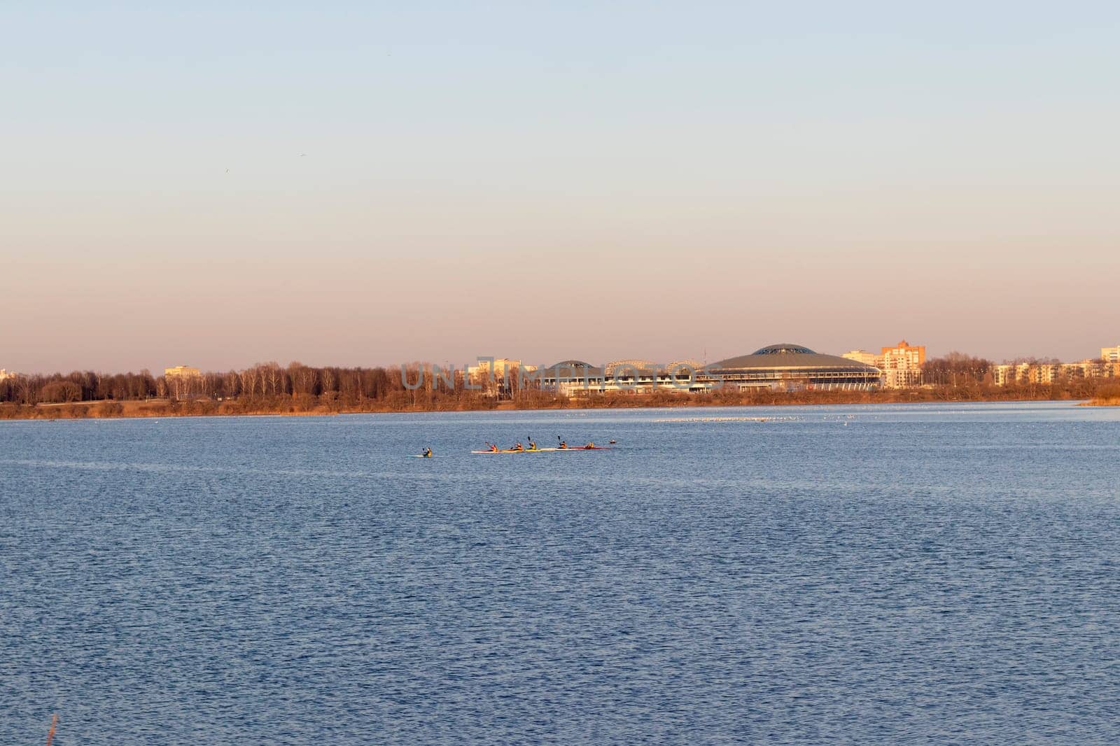 Group of people kayaking on the open water