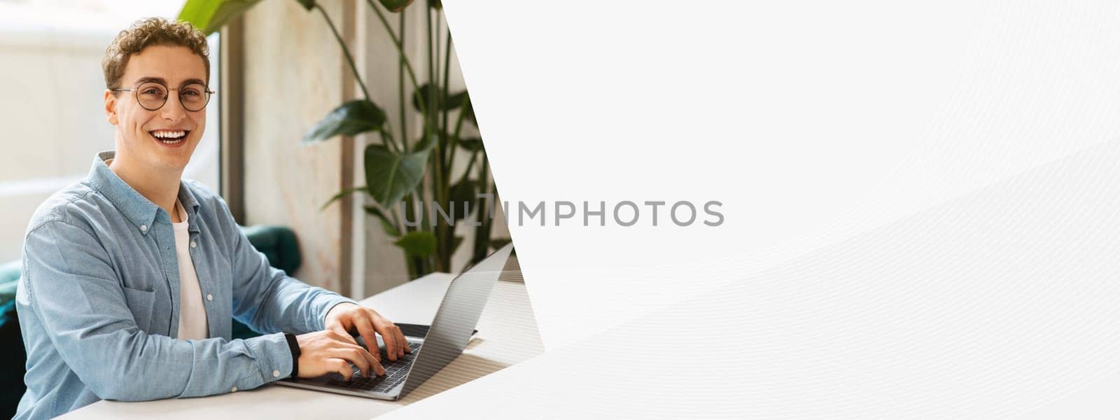 Cheerful young european man student in glasses, typing on laptop, work, study or online communication in cafe with phone. Online meeting, modern lifestyle remotely, digital nomad