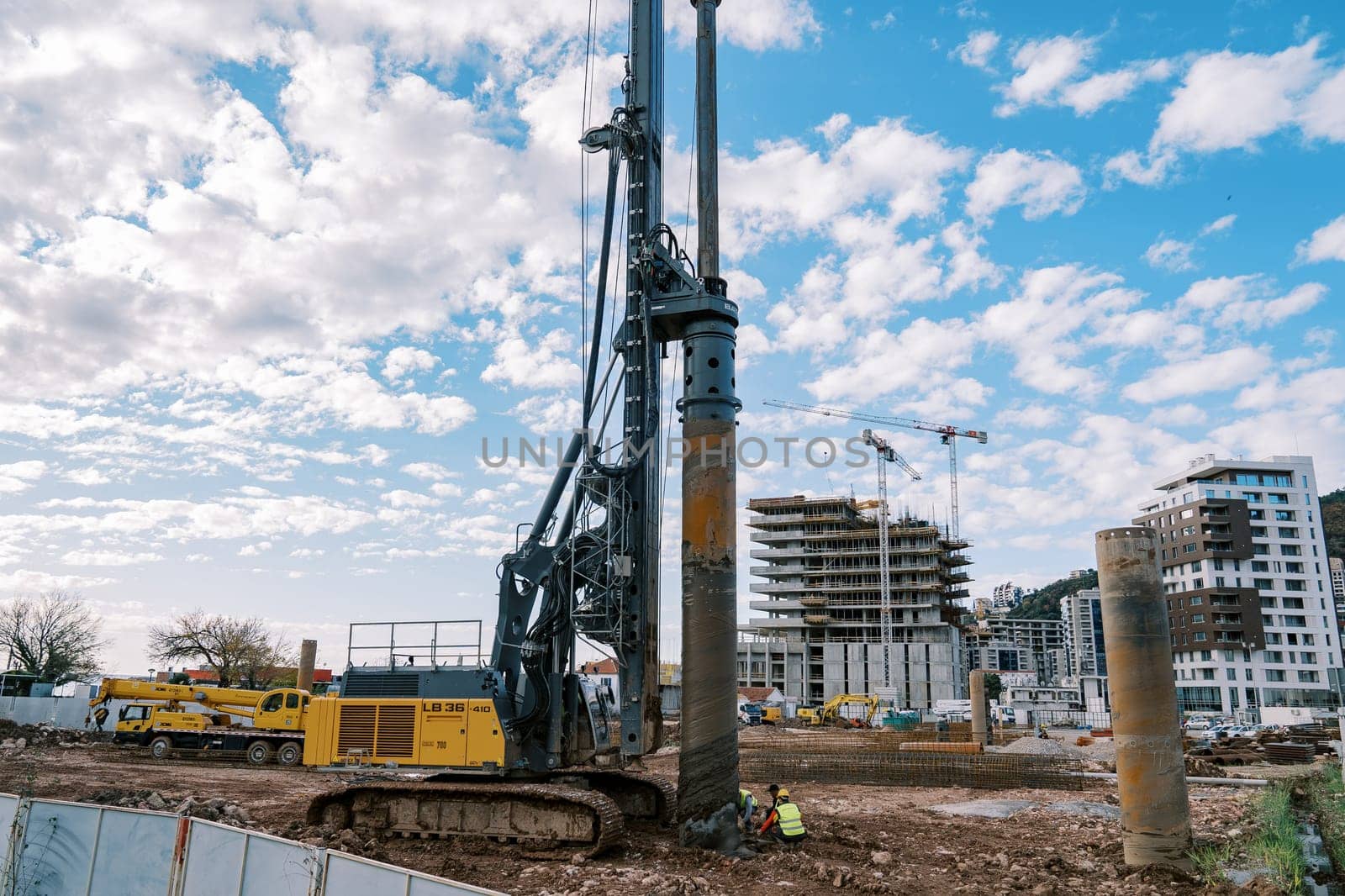 Drilling machine installs piles into the ground at a construction site. High quality photo