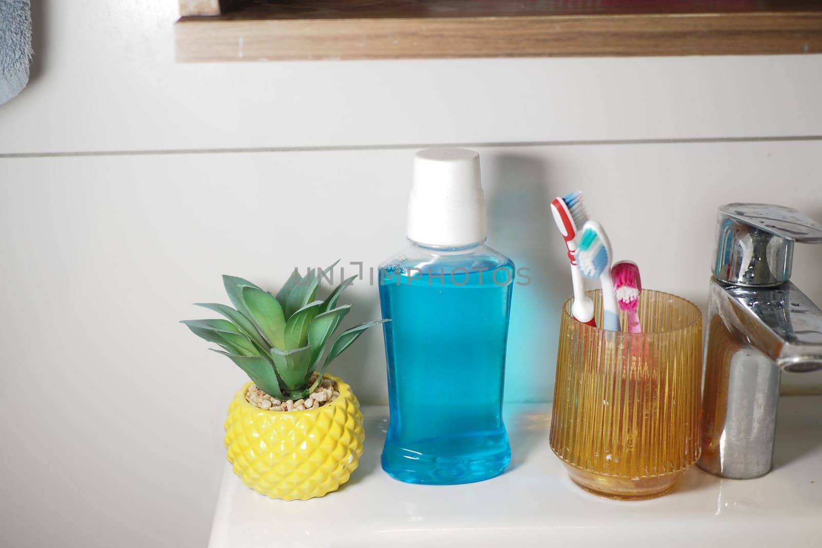Colorful decor and dental essentials create a cheerful bathroom ambiance.