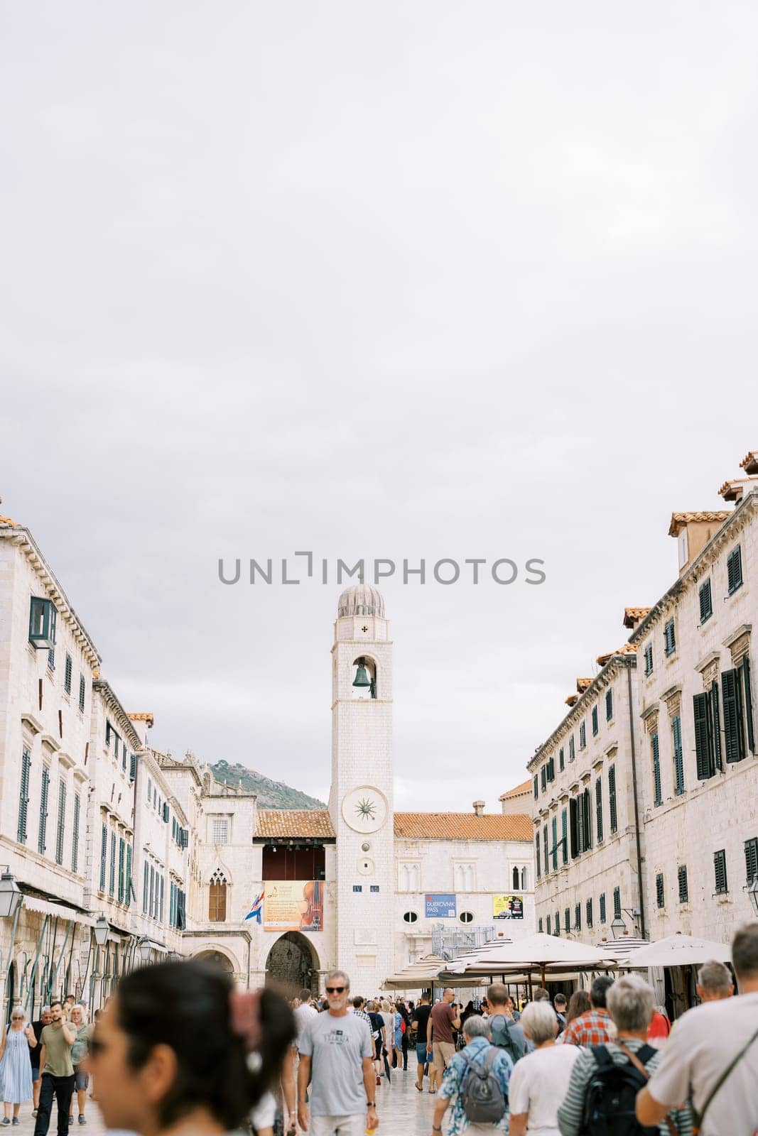 Tall ancient clock tower on the main street of Dubrovnik. Croatia. High quality photo