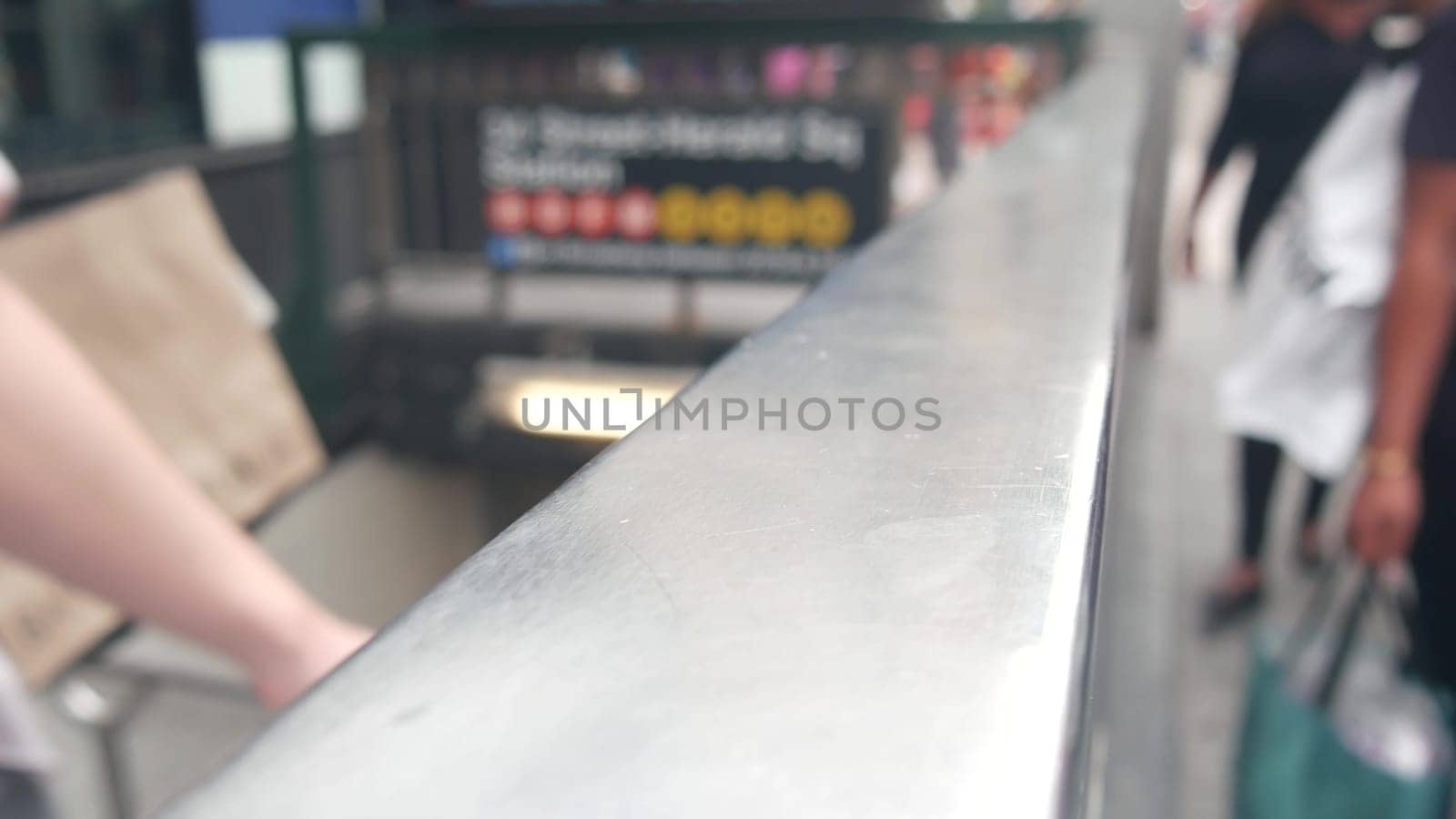 New York City, United States - 29 Aug 2023: Subway sign, underground metro station. Metropolitan entrance fence, public passenger transport exit, text signboard. Pedestrians people on Manhattan street