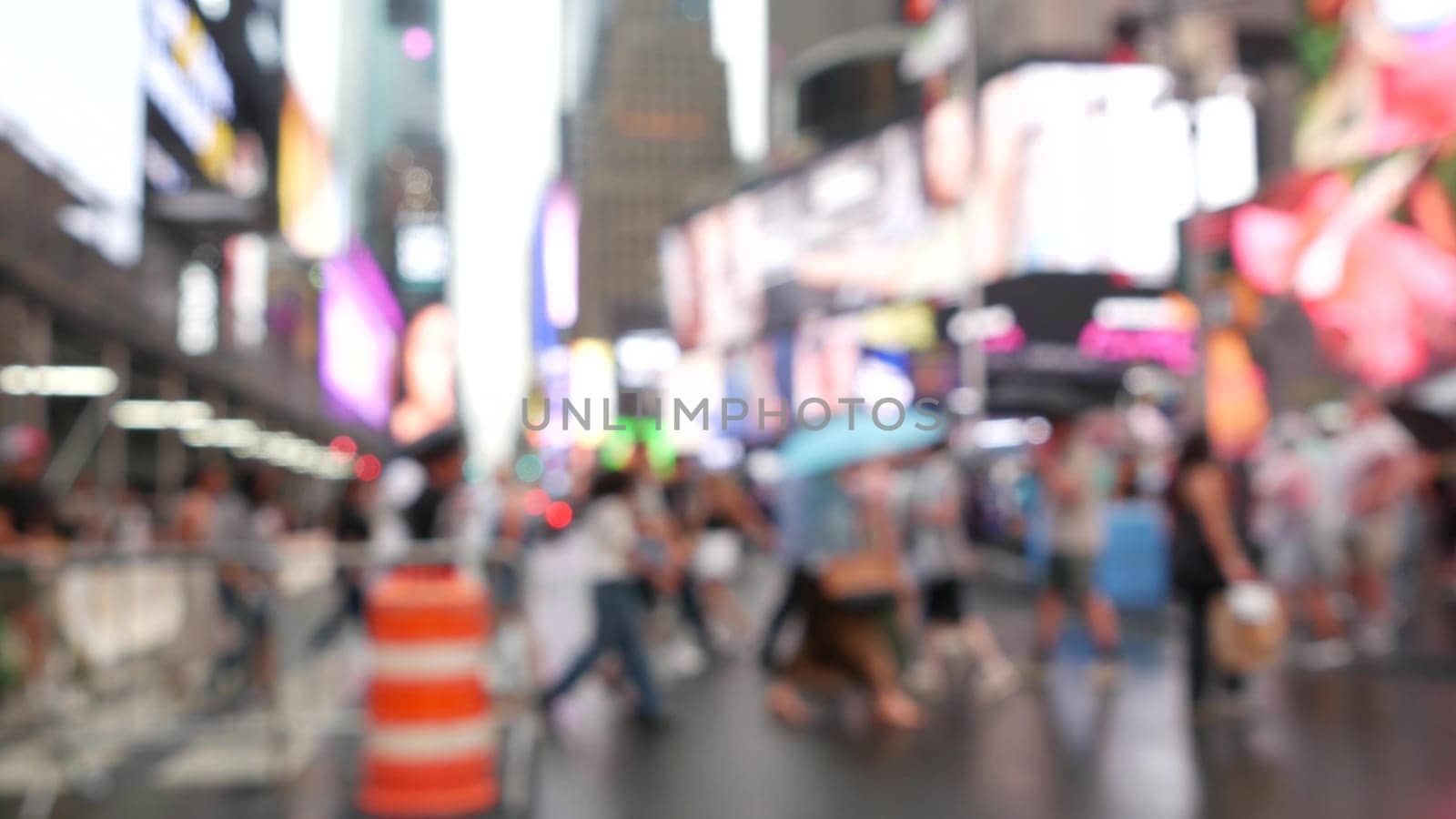 New York City, United States - 10 Sept 2023: Times Square Manhattan Midtown Broadway street, USA. Defocused people pedestrians, zebra crosswalk. NYC urban road traffic. Commercial billboard screens.
