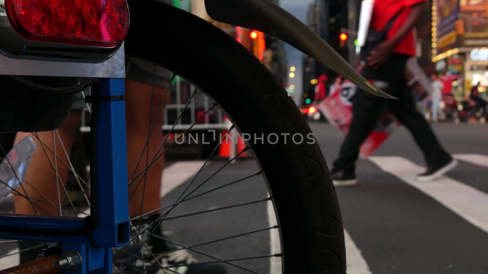 New York City, United States - 14 Sept 2023: Times Square, Manhattan Midtown Broadway street, USA. American NYC urban life. People pedestrians on zebra crosswalk. Road traffic. Low angle, legs or feet