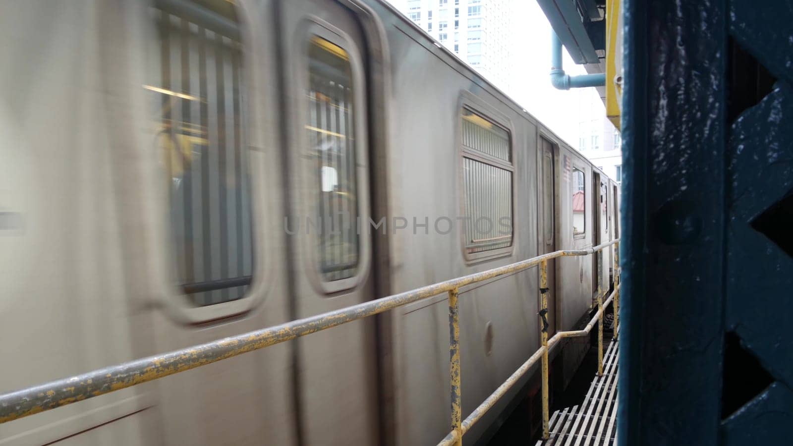 New York City, United States - 29 August 2023: Subway station. Metro train on public transportation platform. Elevated outdoor Court Square railway, Queens. NYC passenger railroad traffic, Long Island