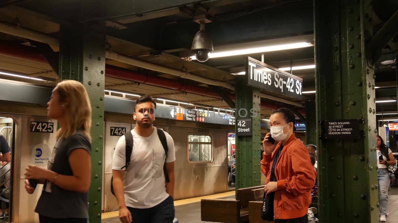 New York City, United States - 1 Sept 2023: Subway station, underground metropolitan train platform sign. Metro railway passenger public transport. Times Square text signboard. People. Manhattan.