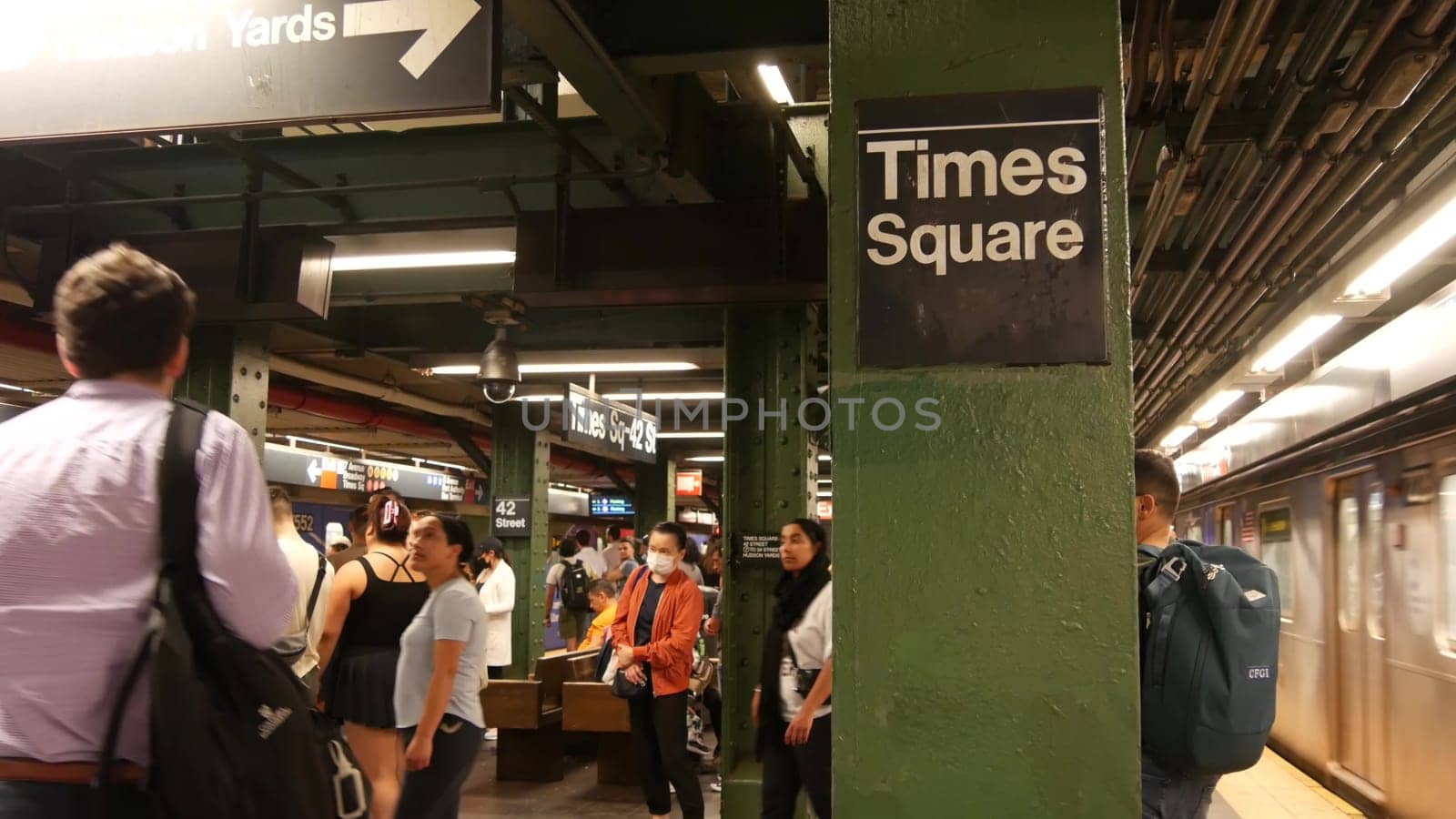 New York City, United States - 1 Sept 2023: Subway station, underground metropolitan train platform sign. Metro railway passenger public transport. Times Square text signboard. People. Manhattan.