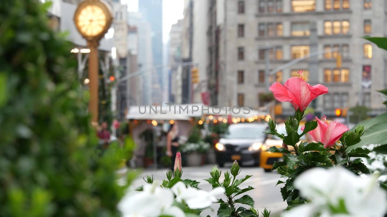New York City, United States - 6 Sept 2023: Manhattan Midtown Broadway, 23 street, 5 avenue crossroad intersection. Worth Square near Madison Park and Flatiron Building, USA. Porcelanosa, taxi, clock.